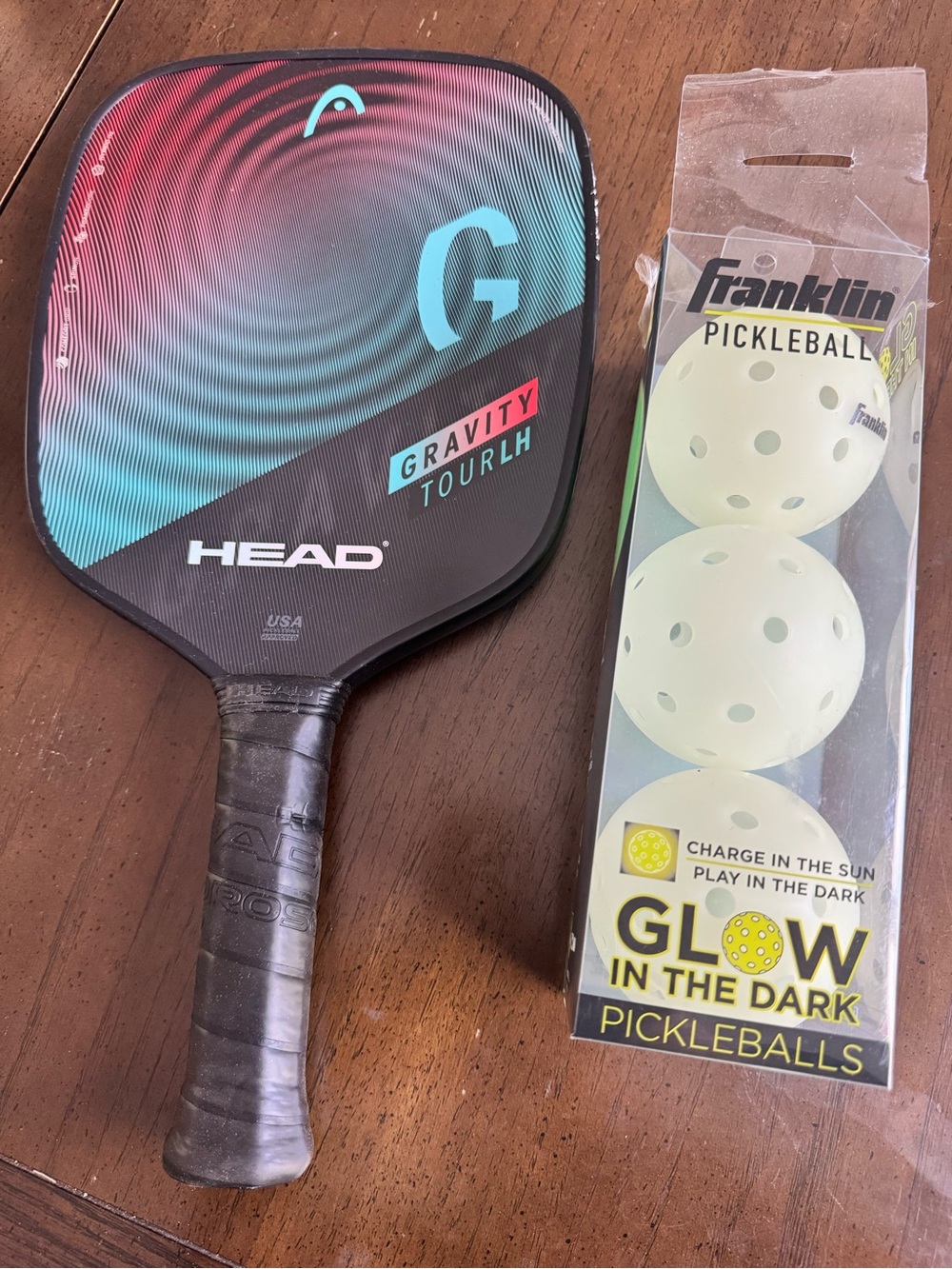 HEAD Gravity Tour Pickleball Paddle in Teal and Red with Glow Balls